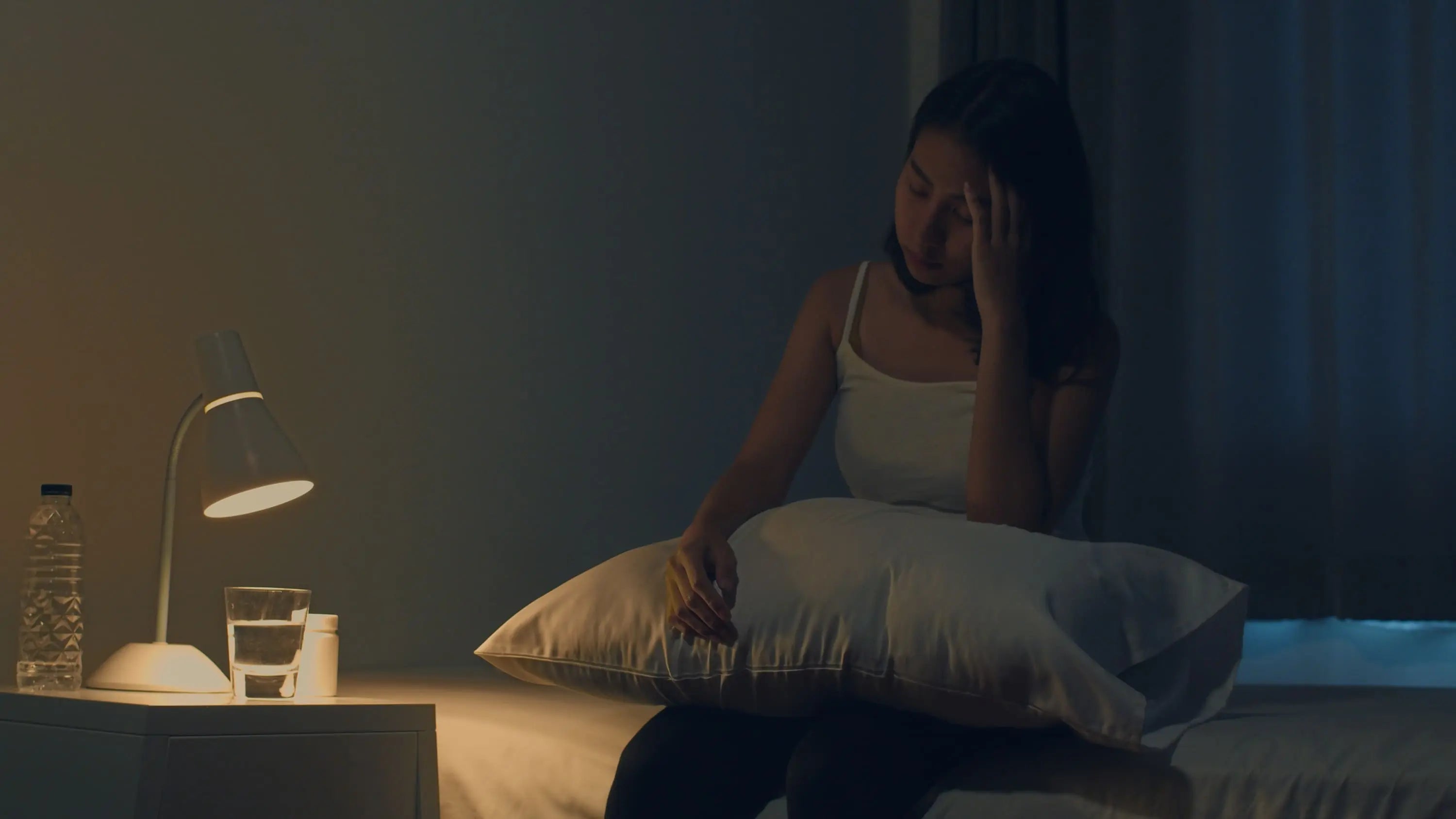 Person lying awake in bed
