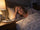 Woman in her 50s lying awake in bed at night, exhausted but unable to sleep because of stress