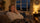 Woman in her 50s yawning on the sofa in the early evening, feeling tired since the clocks went back